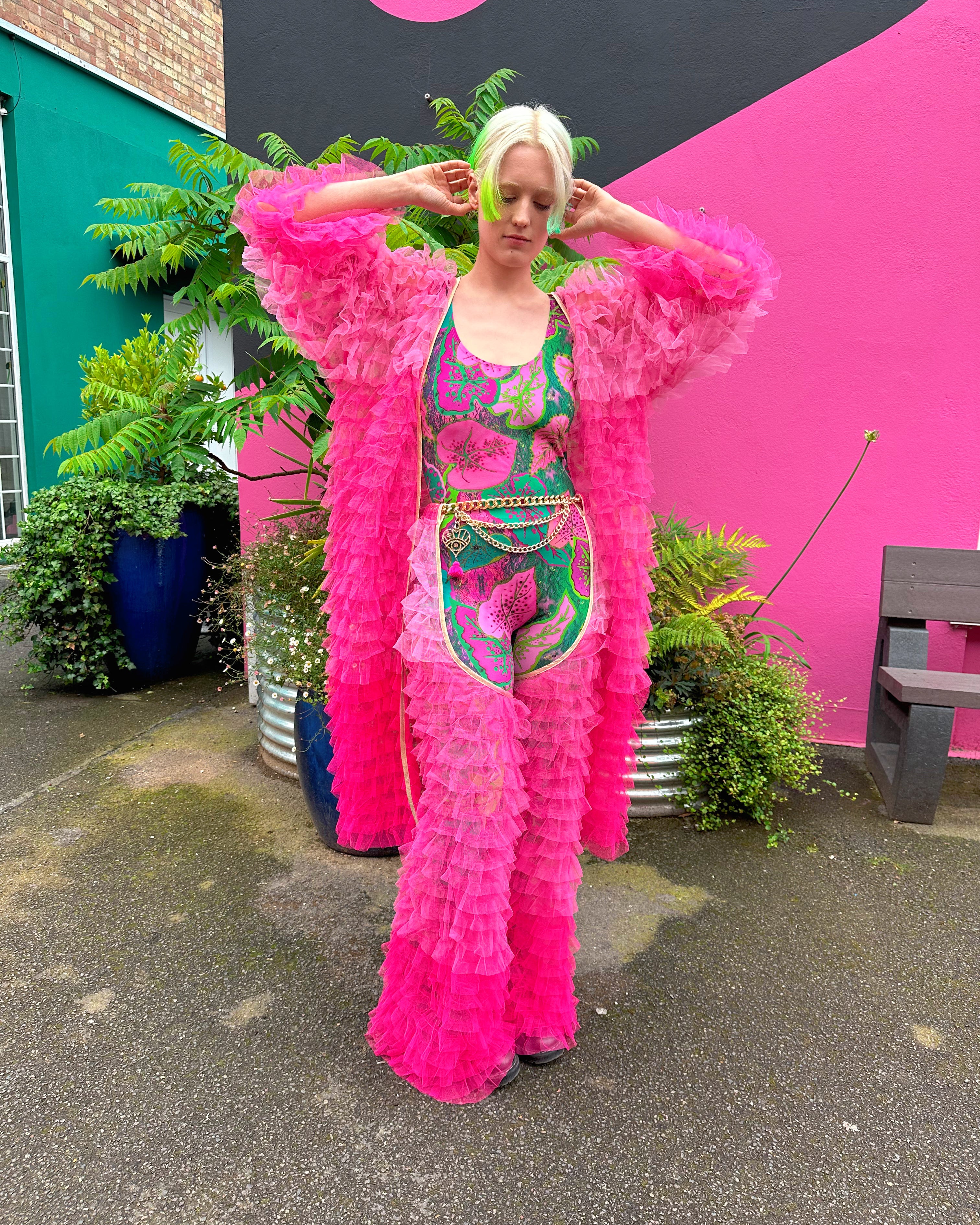 Hot Pink Fringe robe worn with catsuit and chaps