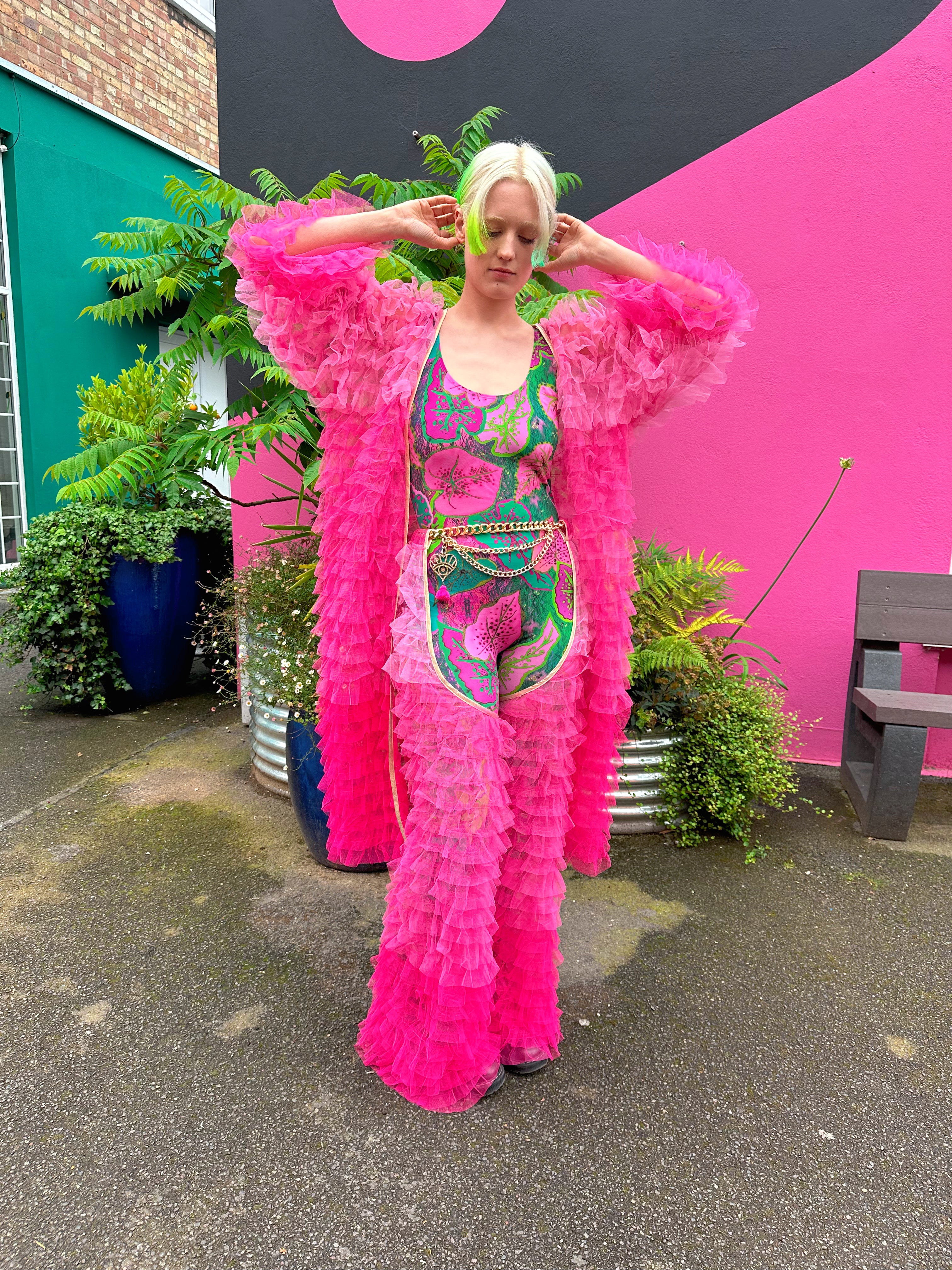 Hot Pink Fringe robe worn with catsuit and chaps