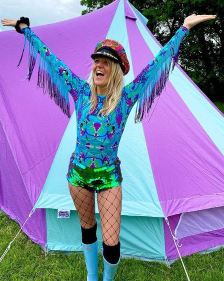 Festival goer wearing tribal tales turquoise blue lycra bodysuit