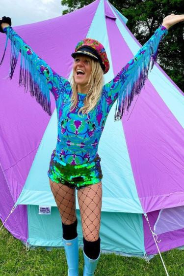 Festival goer wearing tribal tales turquoise blue lycra bodysuit