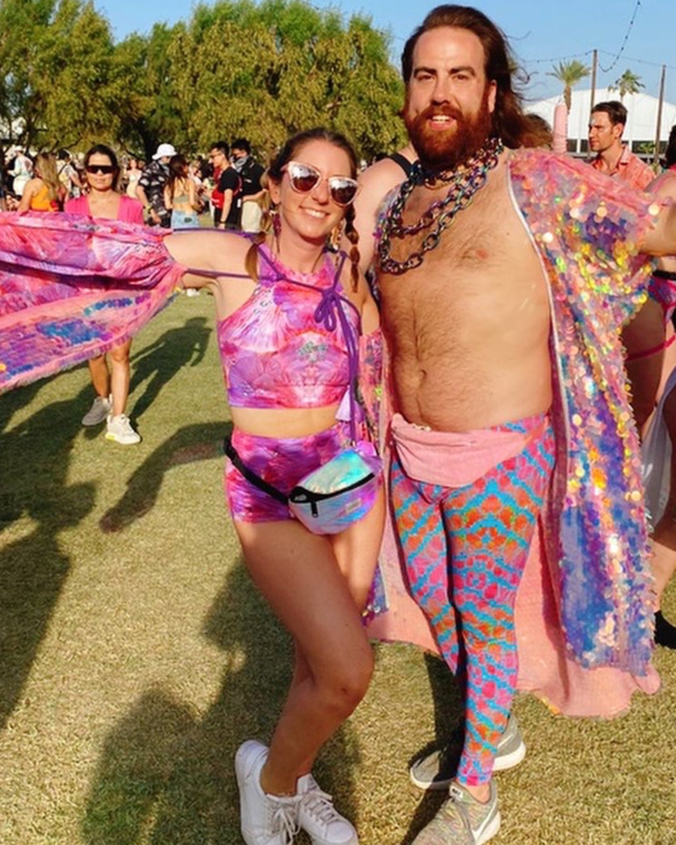 Festival goer wearing L•O•M pink forest of dreams print hot pants and sleeveless crop top