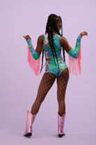 Model on photoshoot background wearing Intergalactic Rodeo lycra outfit including Hot Pants, matching top and sleeves. 