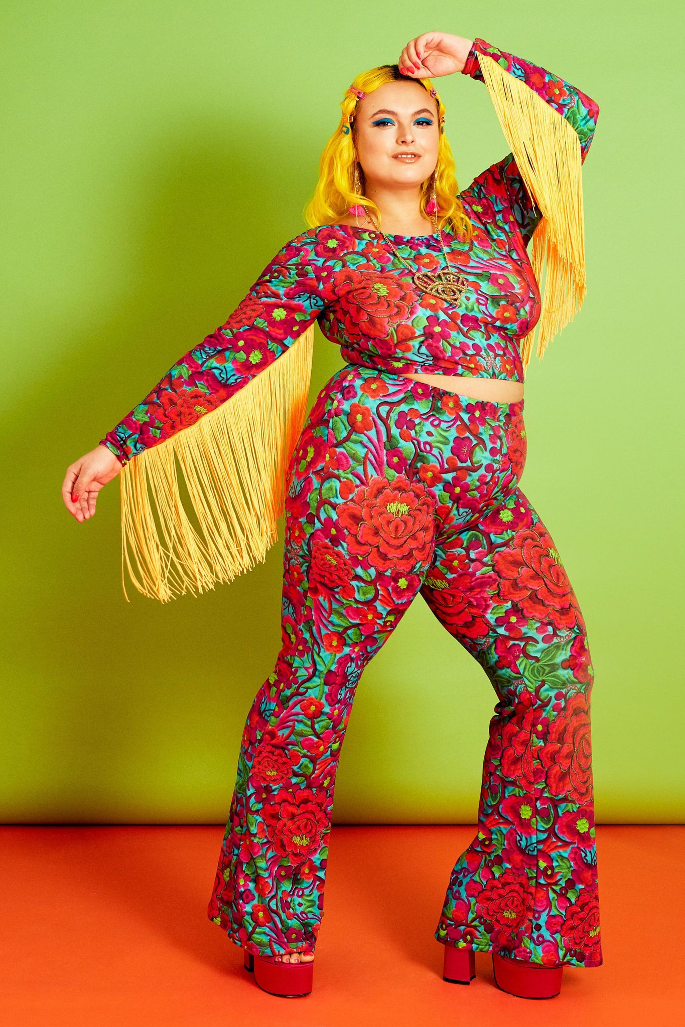 Curvey Model wearing Blue, Pink, Red Folklorico Print Lycra Crop Top with Lyrca Flares