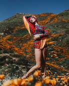 Model wearing folklorico lycra hot pants and crop top with fringe